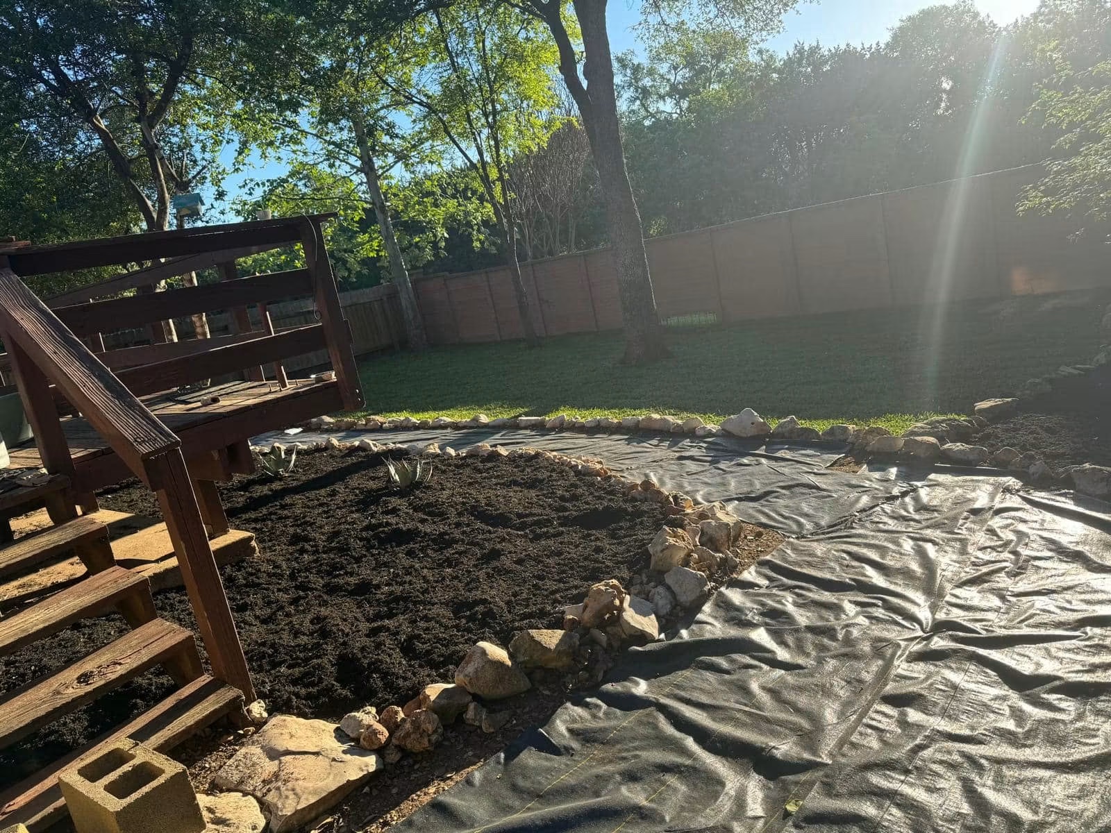 Landscape fabric installed for a residential backyard path