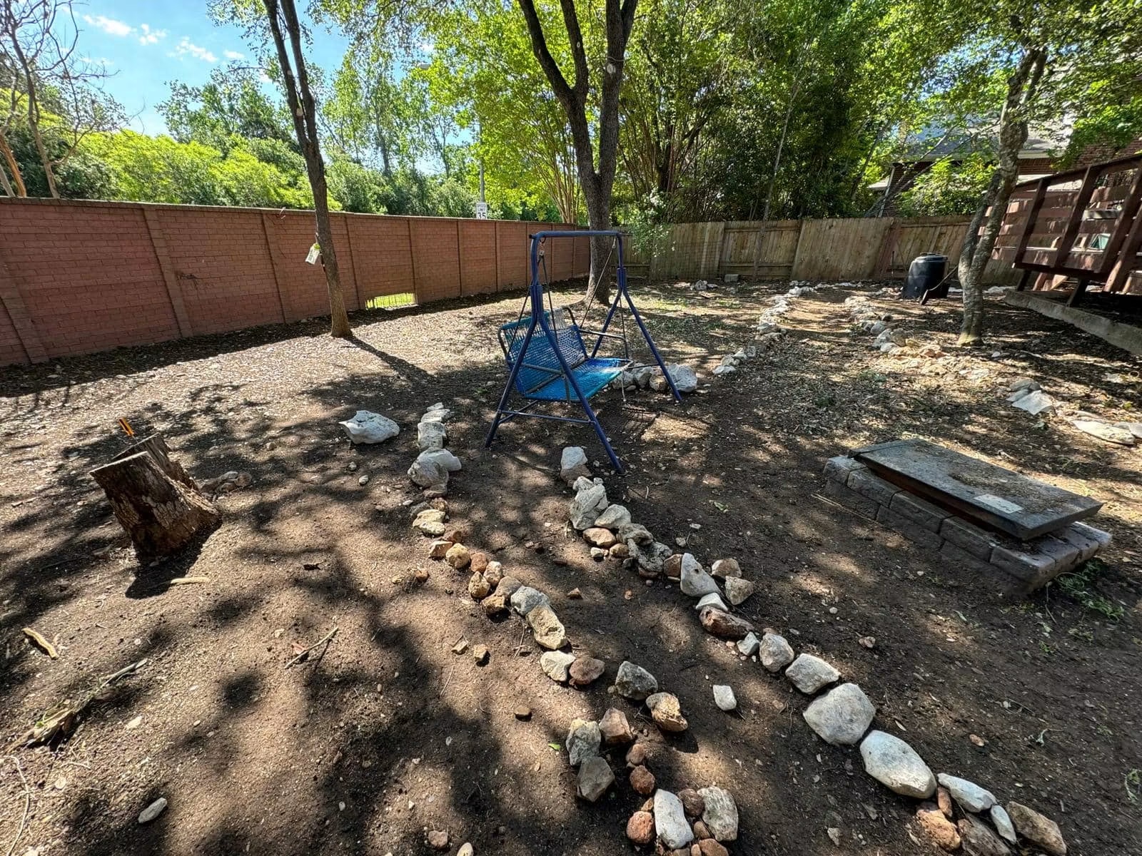Residential backyard before grading and gravel-path construction